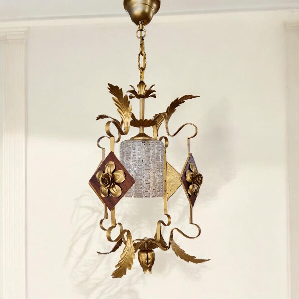 Pair of metal and wood chandeliers with floral decorations